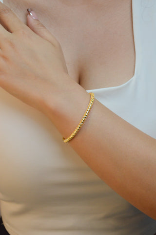Brazalete dorado delgado con zirconia BR01005