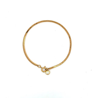 Pulsera dorada de cadena fina con un colgante de una piedra brillante SP0807